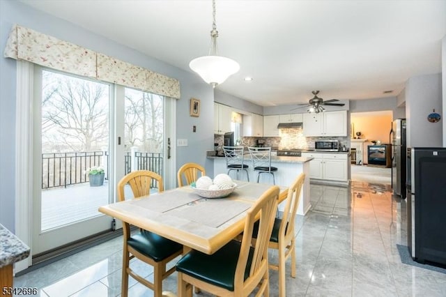 dining area featuring ceiling fan and recessed lighting