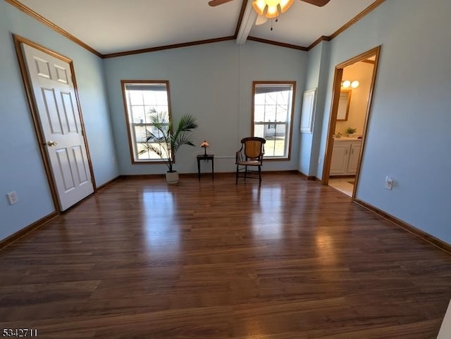 unfurnished room featuring lofted ceiling with beams, baseboards, wood finished floors, and a healthy amount of sunlight