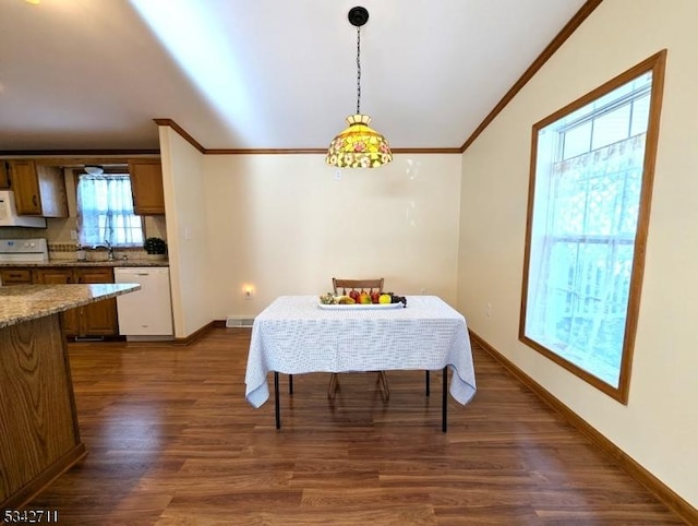 dining space with visible vents, baseboards, dark wood finished floors, and crown molding