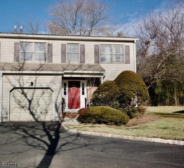 view of front of home featuring a garage and driveway