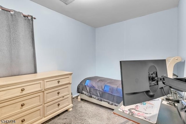 bedroom with light colored carpet