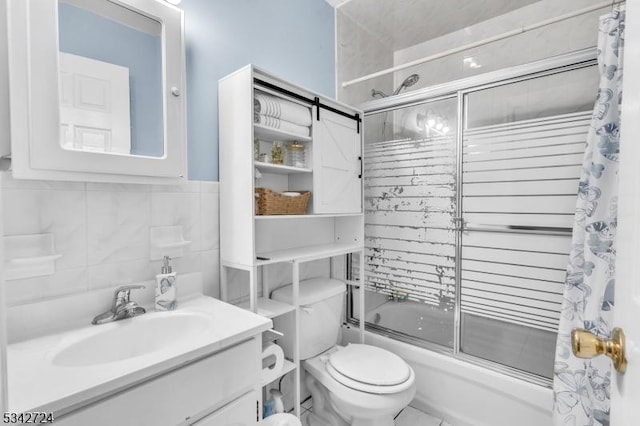 full bathroom featuring tile walls, decorative backsplash, toilet, enclosed tub / shower combo, and vanity