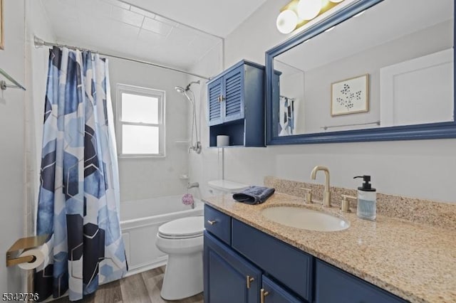 bathroom featuring vanity, shower / bath combination with curtain, wood finished floors, and toilet