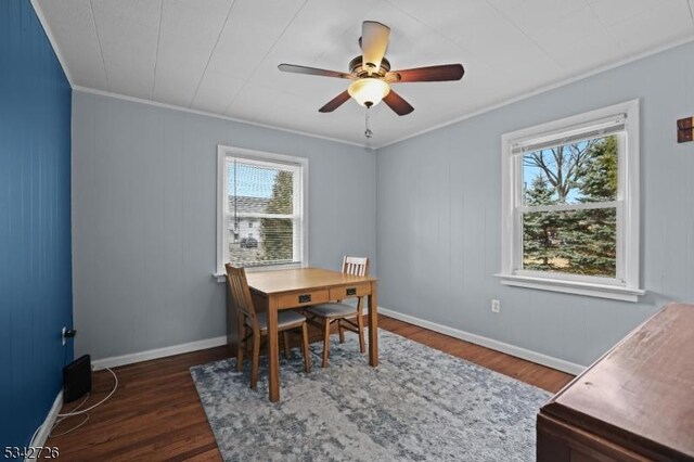 dining room with baseboards, ceiling fan, dark wood finished floors, and crown molding