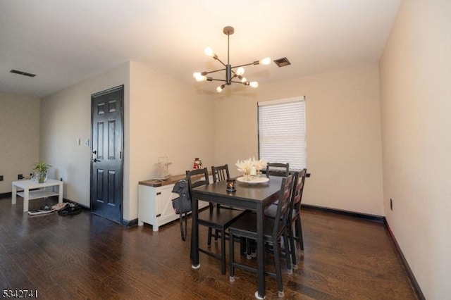 dining space featuring baseboards, visible vents, a chandelier, and dark wood-style flooring