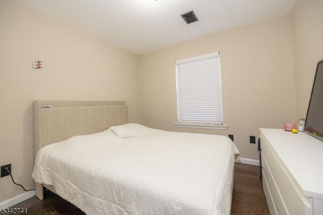 bedroom with visible vents and baseboards