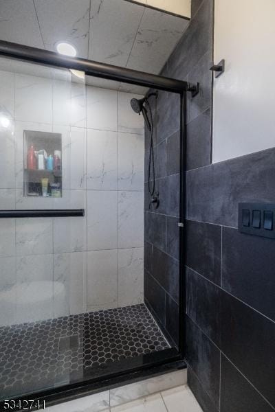 bathroom with a shower stall