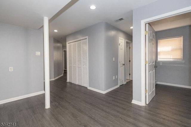 interior space featuring recessed lighting, visible vents, baseboards, and wood finished floors