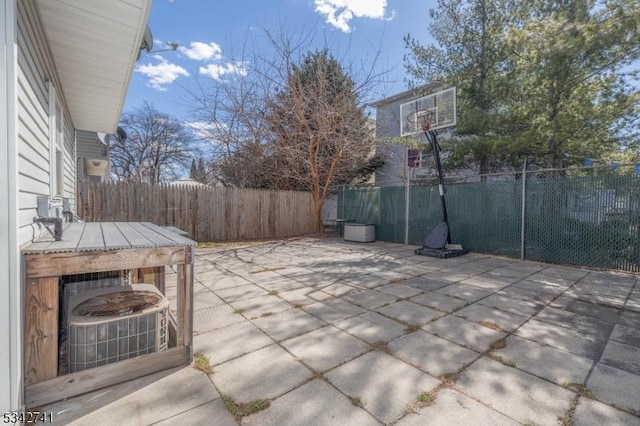 view of patio / terrace featuring cooling unit and a fenced backyard