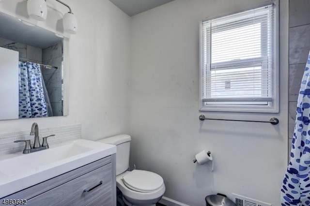 bathroom with visible vents, curtained shower, toilet, decorative backsplash, and vanity