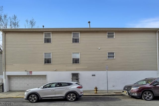 view of property exterior featuring a garage