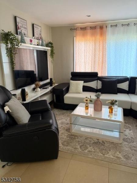 living room featuring tile patterned floors