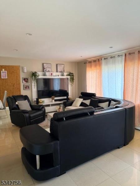 living room featuring light tile patterned floors