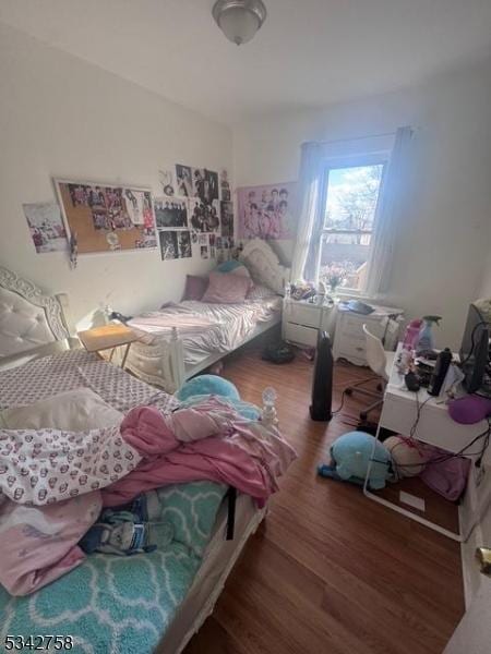 bedroom featuring wood finished floors