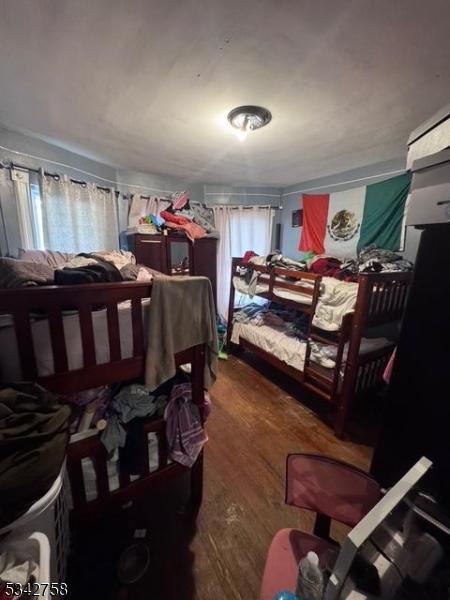 bedroom with wood finished floors