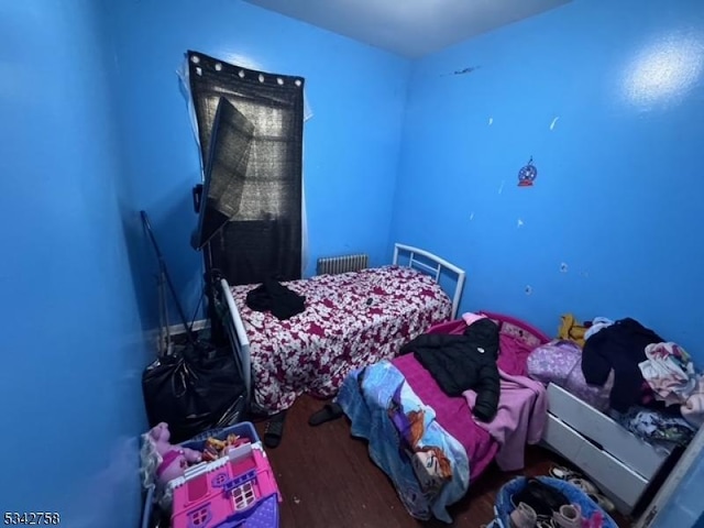 bedroom with wood finished floors