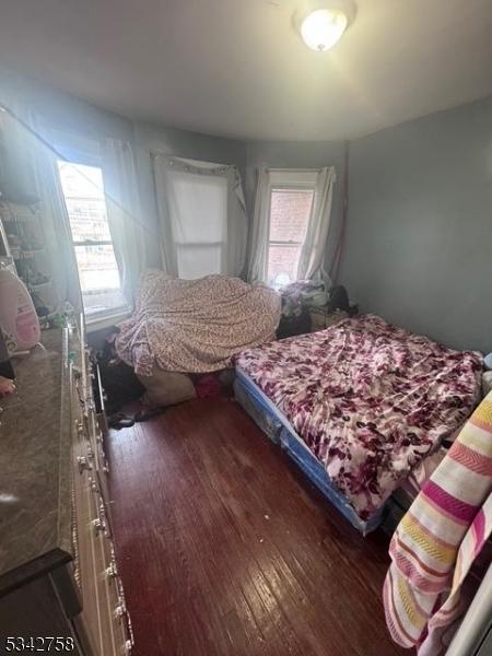 bedroom with wood finished floors