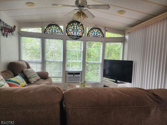 living room with lofted ceiling, ceiling fan, and cooling unit