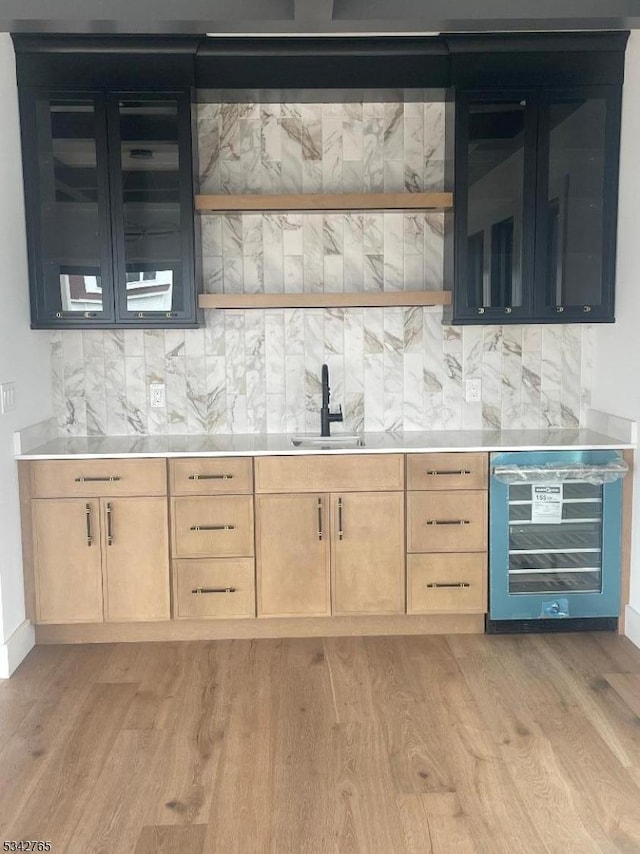 58 Paul Jones Dr, Brick Twp, NJ 08723 - bar with beverage cooler, light wood-style flooring, and decorative backsplash