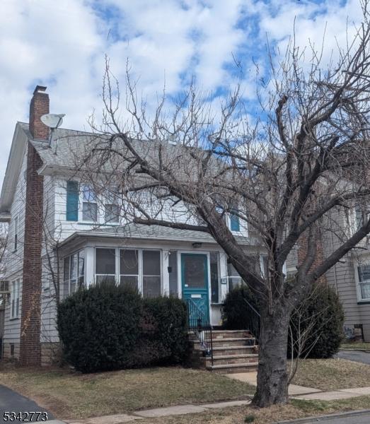 view of front of home with a chimney