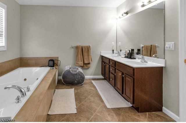 full bath with tile patterned flooring, a sink, a jetted tub, and double vanity