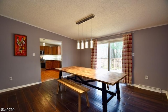 dining space with vaulted ceiling, wood finished floors, baseboards, and a textured ceiling