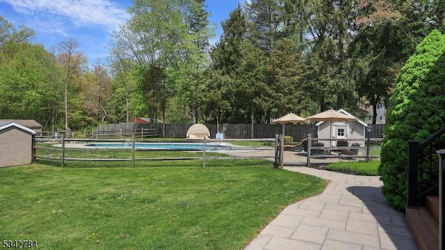 view of yard with an outdoor structure and a storage unit