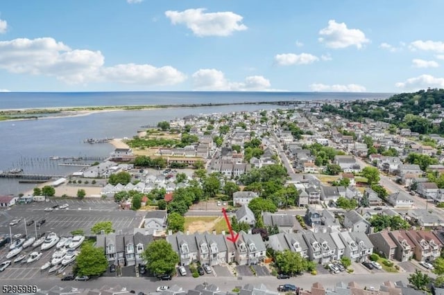 aerial view featuring a residential view and a water view