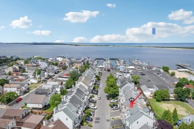 aerial view with a water view and a residential view