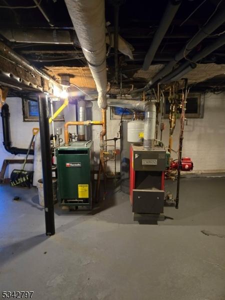 utility room featuring water heater