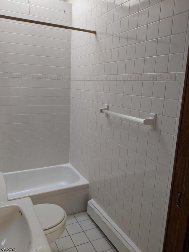 full bath with tile patterned floors, toilet, and shower / bathing tub combination