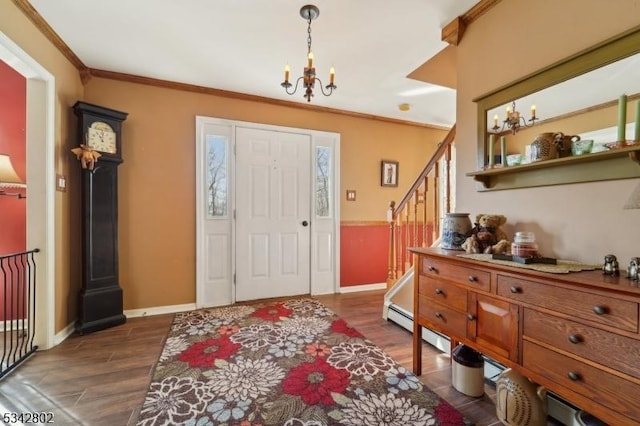 foyer with dark wood-style floors, crown molding, stairway, and an inviting chandelier