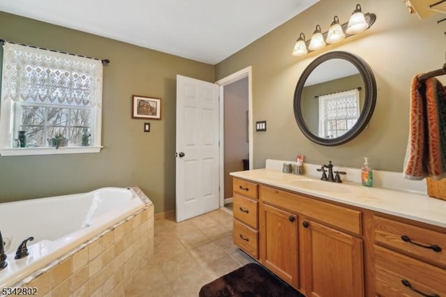 bathroom with vanity, a bath, and tile patterned floors