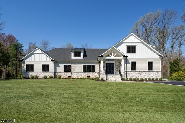 28 Old Forge Dr, Warren Twp, NJ 07059 - view of front of house featuring stone siding, board and batten siding, and a front yard