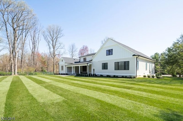 28 Old Forge Dr, Warren Twp, NJ 07059 - rear view of property with a lawn and board and batten siding