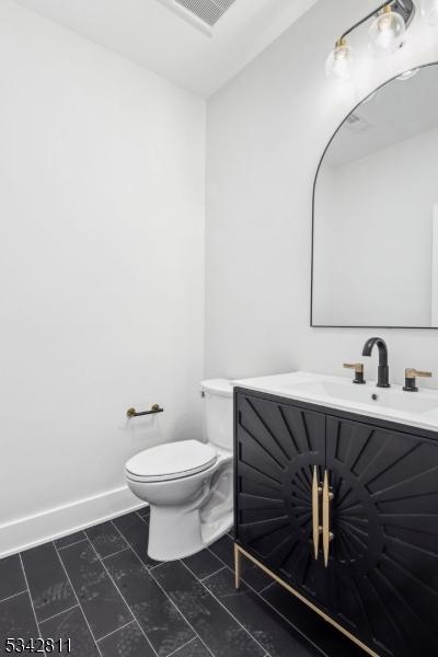 28 Old Forge Dr, Warren Twp, NJ 07059 - bathroom featuring toilet, vanity, and tile patterned floors