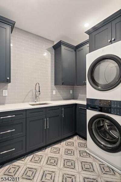 28 Old Forge Dr, Warren Twp, NJ 07059 - washroom featuring stacked washing machine and dryer and cabinet space