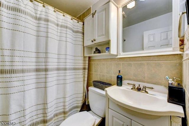 full bath featuring tile walls, a shower with shower curtain, vanity, and toilet