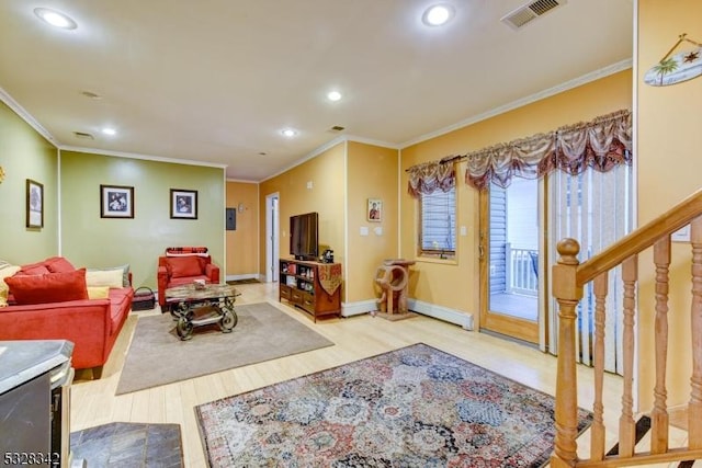 living area with recessed lighting, visible vents, crown molding, and wood finished floors