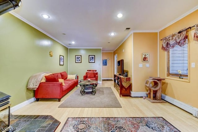 living room featuring visible vents, crown molding, baseboards, and wood finished floors