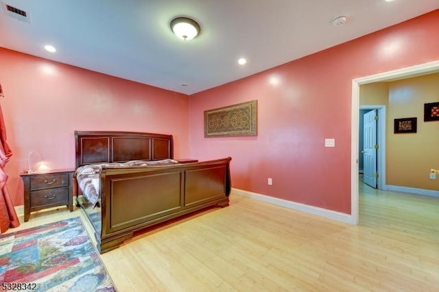 bedroom with recessed lighting, light wood-type flooring, visible vents, and baseboards