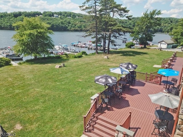 exterior space with a deck with water view