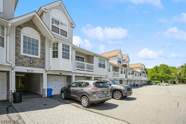 view of parking featuring a residential view