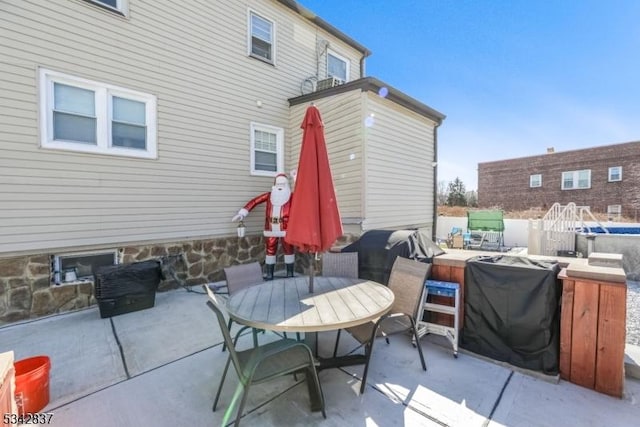 view of patio featuring outdoor dining space and area for grilling