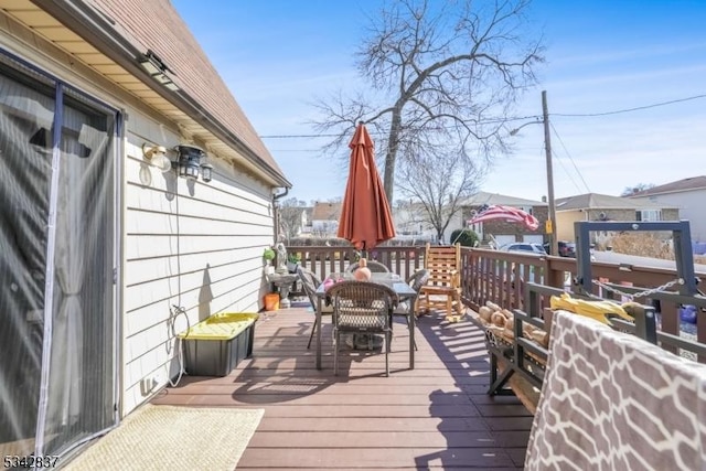 deck featuring outdoor dining area