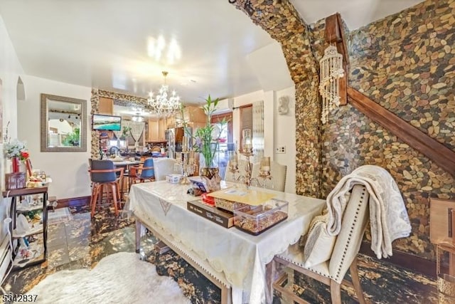 dining space with a chandelier