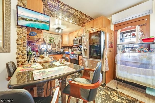 kitchen with dark countertops, appliances with stainless steel finishes, and a wall mounted AC