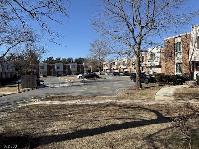 view of road featuring a residential view and sidewalks