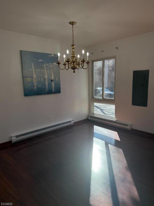 spare room featuring electric panel, a baseboard radiator, baseboards, and baseboard heating