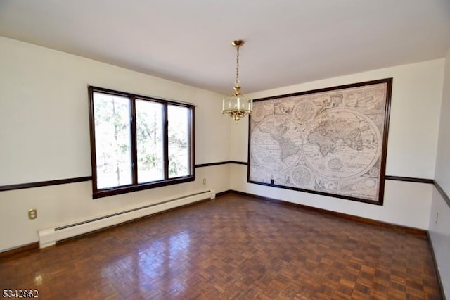 empty room with a notable chandelier, baseboards, and a baseboard radiator